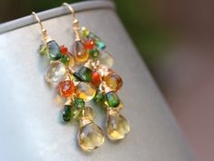 "THE JEWELRY IS SHIPPED via DHL EXPRESS (2-5 days delivery door to door). THE DHL SHIPPING COST IS INCLUDED IN THE PRICE. The Early Autumn Earrings - Multi Gemstone Earrings, Fall colors ► Measurements / Details: - Length including earwire: 2.25\" (~5.7 cm) * can be made longer/shorter per request - Gold: High quality 14K Gold Filled - Silver: High quality Sterling Silver ► Gemstones: The earrings include excellent AAA quality gemstones, they are natural, superbly faceted and vibrant: ~ Light Ci Multicolor Teardrop Earrings With Gemstone Accents, Dangle Multi-stone Earrings For Gifts, Teardrop Multi-stone Earrings As A Gift, Multicolor Gemstone Accent Earrings For Wedding, Multicolor Drop Jewelry With Matching Earrings, Multicolor Gemstone Accented Earrings For Wedding, Multicolor Dangle Earrings With Gemstone Accents, Multi-stone Drop Earrings For Gift, Multicolor Multi-stone Teardrop Earrings