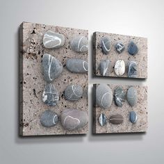 three pieces of art with rocks on them