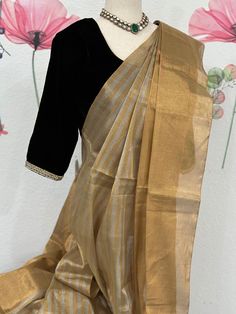 This party wear tissue saree is ideal for occasions when you want to look your best. It is made from high-quality materials and designed with precision to ensure a gorgeous look. The tissue saree is perfect for adding a hint of style and sophistication to any outfit. Black velvet blouse size 34-38 fall & pico done Velvet Saree Blouse, Saree With Black Blouse, Black Velvet Blouse, Velvet Saree, Saree Party Wear, Velvet Blouse, Tissue Saree, Party Wear Saree, Velvet Blouses