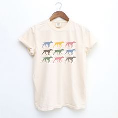 These Comfort Colors shirts are printed with German Shorthaired Pointers in pretty trendy colors. They make the perfect gift for all GSP moms out there!  We love Comfort Colors shirts because they are SO soft. Each shirt is garment dyed making them feel like your go-to favorite shirt you've owned for years. * 100% ring-spun cotton * Fabric weight: 6.1 oz/yd² (206.8 g/m²) * Garment-dyed * Relaxed fit * 7/8″ double-needle topstitched collar * Twill-taped neck and shoulders for extra durability * D Multicolor Print Crew Neck Top With Screen Print, Multicolor Screen Print Crew Neck Top, Multicolor Screen Print Cotton Top, Multicolor Print Crew Neck Cotton T-shirt, Multicolor Print Cotton Crew Neck T-shirt, German Shorthaired Pointer, Cotton Short Sleeve T-shirt With Dog Print, Comfort Colors Shirt, Measurement Chart