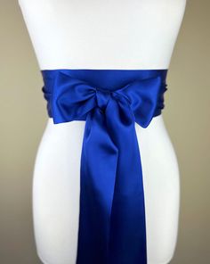 "Cobalt Satin Sash Cobalt Blue Sash, Bridal Sash  Blue Wedding Dress Sash  Dark Royal Blue Dress Sash  Cobalt Wedding Gown Sash  Satin Swank  Make this Satin Swank® reversible waist sash the perfect finishing touch for your wedding, bridesmaid, or special occasion dress, or just the right piece to add instant polish to your dress or top.  This extra long version is 3.5 inches wide, 120 inches long, and will wrap around most waist sizes two times with a generous length remaining to tie in a bow o Blue Party Dress With Sashes, Blue Wedding Dress With Sashes, Elegant Blue Dress With Sashes, Fitted Evening Sash With Tie Back, Fitted Tie Back Sash For Evening, Blue Wedding Dress With Satin Bow, Fitted Bow Sash For Bridesmaid, Fitted Bridesmaid Sash With Bow, Elegant Satin Sash With Tie Back