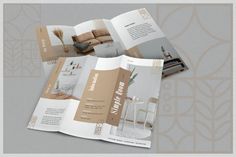 an open brochure is shown on top of a gray background with gold accents