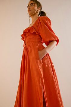 Easy cotton midi dress from our free-est collection featured in a flowy silhouette with a smocked bodice and volume sleeves. * Ruffled neckline * Adjustable tie at bustline * Lined skirt | Oasis Midi Dress by free-est at Free People in Orange, Size: XS Spring Midi-length Puff Sleeve Dress With Smocked Back, Chic Maxi Length Puff Sleeve Dress With Smocked Back, Spring Midi Puff Sleeve Dress With Smocked Back, Chic Maxi Puff Sleeve Dress With Smocked Back, Spring Midi Dress For Gatherings, Summer Midi Puff Sleeve Dress With Smocked Back, Spring Gatherings Ruched Midi Dress, Summer Daywear Puff Sleeve Dress With Ruched Bodice, Square Neck Midi Dress With Ruched Bodice For Daywear