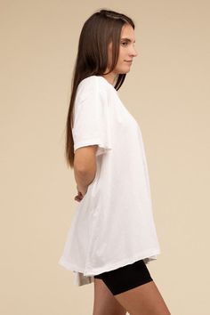 Cotton Drop Shoulder Oversized Top A casual, comfortable addition to your wardrobe. This top offers a relaxed, oversized fit, high/low hem, and raw edge details for effortless casual style. Round neckline Oversized fit Raw edge detail Drop shoulder High/low hem Fit: True to size for an oversized fit Fabric Content: 100% Cotton Model is 5'9" wearing a size small Sizing: S/M (0-8), L/XL (10-14) *Online Exclusive* Drop Shoulder Top, Distressed Denim Skirt, Cute Bathing Suits, Oversized Top, Sheer Fabric, Suede Jacket, Sheer Fabrics, New Tops, Neck Line