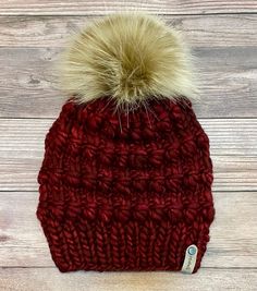 Luxury teen or adult beanie made with Malabrigo Rasta yarn and topped with a large faux fur Pom which is removable. This is a beautiful deep red color called Pagoda with exquisite texture to keep you warm and cozy! Made with 100% merino wool this is a luxury beanie that will last a long time, and fits generously all adult sizing head circumference 18-23." This the Abalone beanie pattern @woolandknits. Hand wash only in cold water and lay flat to dry. Remove Pom before washing. This would make a Red Winter Beanie One Size Fits Most, Red Winter Beanie, One Size Fits Most, Red Knitted Beanie For Winter, Red Knitted Winter Beanie, Red Beanie For Fall, One Size Fits Most, Red Winter Beanie, Red Knitted Hat For Fall, Cozy Red Beanie For Winter, Cozy Red Beanie For Fall