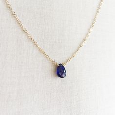 This is a blue sapphire necklace that is made of genuine high quality sapphire. This tiny stone necklace is light weight and elegant. Sapphire is September birthstone. It's a great gift for September birthday friends and families. The sapphire I use in this necklace is translucent with high quality. For this type of gem, the more blue and translucent of the saphire, the more expensive it is. Blue sapphire's hardness is 9 while diamond is 10. Measurement: 9mm by 6mm blue sapphire S for Sparkle on Sapphire Drop Necklace For Gift, Sapphire Drop Necklaces For Gifts, Tanzanite Briolette Necklace Gift, Sapphire Teardrop Pendant Necklace Gift, Sapphire Teardrop Necklace For Gift, Briolette Tanzanite Necklace For Gift, Blue Sapphire Gemstone Birthstone Necklace, Sapphire Tanzanite Birthstone Necklaces, Blue Sapphire Birthstone Necklace