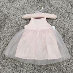 - Baby B'gosh Baby Girl's Dress - Size 9 Months - Color: Baby Pink - Bodice And Overskirt: 100% Polyester - Lining: 100% Cotton - Tulle Overlay - Spanks Included - Spaghetti Straps - Stretch Back - Small Bow On Front Center - Matching Hanger Included - New With Tags Spring Tulle Tutu Dress For Playtime, Spring Playtime Tulle Tutu Dress, Summer Princess Style Tutu Dress For Play, Spring Playtime Tulle Dresses, Summer Tutu Dress For Play, Sleeveless Tutu Dress For Play, Cute Tulle Dress For Playtime, Pink Summer Tutu Dress For Play, Pink Tutu Dress For Summer Play