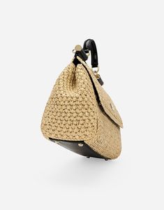 Large raffia crochet Sicily handbag: Beige Front flap with hidden double magnetic fastening Branded tag featuring two metal plated finishes Top handle and adjustable, detachable strap in python skin Fabric lining Inner pocket with branded zipper, card compartment and a flat pocket Metal feet studs on the base Item comes with a branded dust bag Measurements: H21 x W25 x D12 cm Made in Italy Raffia Crochet, Python Skin, Brand Tags, Sicily, Python, Top Handle, Dolce And Gabbana, Dust Bag, Women Handbags