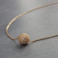 This piece is BEAUTIFUL- the photos I took really don't do it justice. 14K gold plated ball slider pendant set with tons of tiny glittering pave style cubic zirconia {CZ} that sparkle like diamonds. Chain is a simple thin fine gold-plated brass tiny cable link with matching lobster style clasp. Dress it up or down- it'll be your new favorite go-to piece.  Optional upgrade to a 14K gold fill chain. Slightly smaller pave ball version {6mm instead of this 8mm} here: https://www.etsy.com/listing/1015452975/gold-cz-ball-necklace-round-crystal Available in silver- as seen in photo on model: https://www.etsy.com/listing/849780641/silver-crystal-ball-necklace-round-cz { M e a s u r e m e n t s } Envisioning measurements online is HARD and I don't want you to be surprised. Please be sure to double Gold Chains Models, Gold Ball Pendant, Crystal Ball Necklace, Diamond Ball, Chain Diamond, Simple Chain, Heirlooms Jewelry, Round Pendant Necklace, Ball Chain Necklace