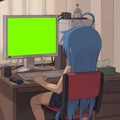 a person sitting in front of a computer with a green screen on their back legs