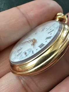 This is a beautiful collectiblae antique signed Poitevin Geneve fob/ pocket watch 18ct yellow gold, hand-winding- with 36954 serial number with white enamelled dial having black Roman numerals with gold toned decorative hands, outer minute ring and subsidiary seconds dial in contrast. It's monogrammed to rear cover. It's in working order when listing (it'd be better a service perhaps, not very precise at the moment). It has a continental hallmark. Tested as 18 carat gold too. In very good antique condition. Please notice all antique items might have slight wear or alike in keeping with their age and use. Please study my pictures.  Total weight 36.75 grams Height including jump ring 50.5mm Diameter 35.7mm 5200724 Antique Yellow Gold Chronometer Watch, Victorian Yellow Gold Pocket Watch With Chronometer, Antique Yellow Gold Watch With Round Dial, Victorian Gold Watch With Chronometer, Victorian Style Gold Watch With Chronometer, Luxury Yellow Gold Pocket Watch With Chronometer, Antique Yellow Gold Round Watches, Victorian Yellow Gold Pocket Watch For Formal Occasions, Luxury Gold Pocket Watch With Chronometer