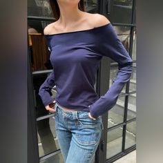 Cotton Blend Off The Shoulder Long-Sleeve Top With A Raw Hem. Fabrics: 96% Cotton, 4% Elastane Measurement: 19"(48 Cm) Length, 18"(46 Cm) Bust Made In: Italy Blue Off-shoulder Top For Fall, Blue Cotton Long Sleeve Top, Fitted Blue Long Sleeve Top For Spring, Blue Cotton Stretch Long Sleeve Top, Blue Stretch Cotton Long Sleeve Top, Navy Long Sleeve Blouse For Fall, Long Sleeve Navy Blouse For Fall, Blue Stretch Long Sleeve Blouse, Trendy Blue Long Sleeve Top For Fall