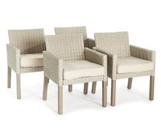 three wicker chairs sitting next to each other