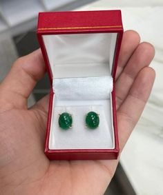 Featured here is a beautiful set of oval cut cabochon emerald studs in fine 14K yellow gold. Displayed are rich-green emeralds with very good transparency, accented by a simple four-prong claw gold mount, allowing for the emerald to be shown in full view. The earth mined, green cabochon emeralds have a desirable lush green color with excellent qualities. These earrings are ideal for everyday use and are the perfect accessory to any outfit. Setting Style: Four Prong Setting Material: 14K Yellow G Luxury Oval Cabochon Gemstone Earrings, Luxury Oval Gemstone Earrings, Oval Yellow Gold Cabochons For Formal Events, Luxury Oval Cabochon Earrings For Anniversary, Oval Cabochon Fine Jewelry With Polished Finish, Polished Oval Cabochon Fine Jewelry, Fine Jewelry Oval Gemstone Cabochons, Classic Oval Cabochons For Anniversary, Green Oval Cabochons Fine Jewelry