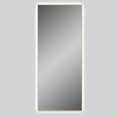 an illuminated mirror on the wall with a white light above it and a black frame