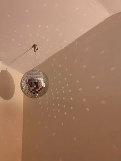 a disco ball hanging from the ceiling in a room