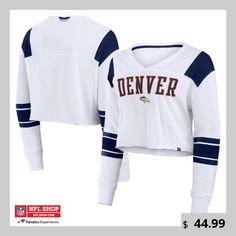 Elevate your Denver Broncos game day style with this Fanatics Stretch Cropped Fashion Long Sleeve T-Shirt. This stylish top features an embroidered appliqu team logo on the chest and a tackle twill team wordmark for bold Broncos spirit. The cropped design and oversized fit create a trendy and flattering silhouette. Jersey Sports Fan Tops For Sports Events, Collegiate White Top For Football Season, White Collegiate Top For Football Season, Varsity Tops For Fall Sports Events, Varsity Tops For Sports Events In Fall, Team-colored Tops For Sports Events In Fall, Varsity Style Tops For Fall Sports Events, Fall Varsity Style Tops For Sports Events, Sporty T-shirt With Embroidered Graphics For Game Day