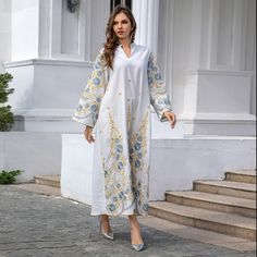 Description Details: Material: Polyester Pattern: Floral Style: Ethnic Style Season: Summer Fitness: Regular Collar Type: V-Neck Sleeve Type: Regular Sleeve Sleeve Length: Long Sleeve Hem Shaped: General Elasticity: Non-Elasticity Occasion: Casual Craft: Embroidery Size M L XL Length(CM) 134 134 135 Bust(CM) 108 113 117 Sleeve(CM) 57 57 57 Spring V-neck Chikankari Embroidered Dress, Spring V-neck Kaftan With Chikankari Embroidery, Festive V-neck Kaftan With Floral Embroidery, Eid Chikankari Embroidery V-neck Dress, Traditional Embroidered V-neck Dress For Eid, V-neck Chikankari Embroidery Dress For Vacation, Festive V-neck Kaftan, Elegant V-neck Chikankari Embroidered Dress, V-neck Floral Embroidered Dress For Eid