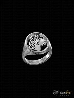 a signet ring with an image of a woman's head in the center