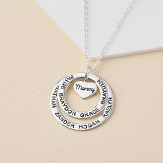 "This necklace is a meaningful and sweet gift for grandma, with her being in centre on a heart charm and grandkids' names surrounding her. A perfect gift for Grandma on any occasion. PRODUCT INFO * Materials: 925 sterling silver with 18K yellow gold or rose gold plate options. * Small ring measures approx. 3/4\" (20mm). Big ring measures approx. 1\" (26mm). Heart charm approx. 0.37\" x 0.32\" (9.8 x 8.5mm) * WORD LIMIT: Small ring: 4-5 words / Big ring: 6 words. Date is counted as 2 words. * By Mother's Day Heart Necklace With Birthstone For Birthday, Mother's Day Birthstone Heart Necklace For Birthday, Mother's Day Birthday Birthstone Heart Necklace, Birthstone Heart Necklace For Birthday And Mother's Day, Silver Heart Necklace With Hallmark For Birthday, Heart Pendant Charm Necklace For Birthday And Mother's Day, Mother's Day Birthday Name Necklaces, Name Necklaces For Birthday And Mother's Day, Personalized Round Heart Necklace For Mom