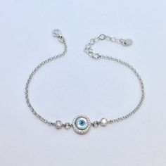 Mother of Pearl Evil Eye Bracelet, Gold Evil Eye Bracelet, 925 Silver Sterling Bracelets for Women, Handmade Jewelry, Gift for Wife Absolutely EYE catching! A beautiful round mother of pearl with an inlaid evil eye. I paired this one with a beautiful beaded curb chain. This beauty will keep bad spirits at bay, and good ones in your corner, Enamel Evil Eye bracelet, Gold Evil Eye bracelet, 925 Silver sterling, Handmade Jewelry Your choice Sterling silver or Gold vermeil with gold filled chain. Mo Pure Silver Bracelet For Women, Sterling Silver Round Bracelets For Gifts, Sterling Silver White Gold Crystal Bracelet Gift, White Gold Sterling Silver Crystal Bracelet Gift, Dainty Silver Crystal Bracelet As Gift, Dainty Silver Crystal Bracelet For Gift, Silver Crystal Bracelet With Adjustable Chain For Gift, White Sterling Silver Crystal Bracelet, White Sterling Silver Round Crystal Bracelet