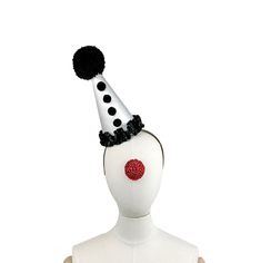 Clown Hat On Headband. Black and White, Circus Hair Accessory, Halloween Costume, Handmade Pom Pom, Birthday Party, Photo Prop This mini clown hat is made from a white satin over a buckram frame that has been also covered in another layer of fabric underneath- so it's super sturdy and has a perfectly smooth surface. The pom pom on top is black and hand made! It stands 8" inches high. You won't see a hat like this anywhere else! It comes on a headband that goes through elastic on the botton so you can slide it into any position on your head. I use only the most comfortable headbands that fit kids or adults comfortably. Calling all party girls! Clown couture is the new black! Great for kids, too! Shipping Policy: All items are sent through the US Postal Service first class with tracking. Ple Clown Couture, Black And White Circus, Pom Pom Birthday, Circus Hair, Clown Hat, Headband Black, Comfortable Headbands, Fit Kids, Party Photo