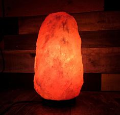 a himalayan rock lamp on a wooden table