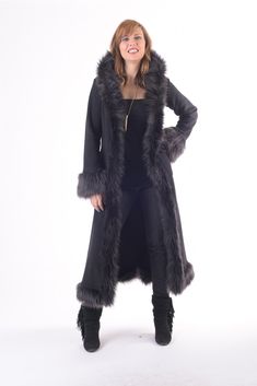 This long winter coat is soft and warm yet lightweight at the same time and is made from the highest quality materials. This is one of my most popular styles. Large fabric covered hook closures in the front. Outer pockets lie flat against the sides. Can also be ordered without a hood or shorter in length. Sizing is 1 (small/medium) or 2 (medium/large). Features: * Large fabric covered hook closures in the front. * Lined with double layer anti-pill polar fleece. * Outer pockets lie flat against t Fitted Faux Fur Coat For Cold Weather, Winter Faux Fur Long Coat, Fitted Long Sweater Coat For Cold Weather, Fitted Faux Fur Hooded Coat, Fitted Hooded Faux Fur Coat, Winter Wool Coat With Faux Fur Trim, Cold Weather Long Coat With Faux Fur Lining, Long Coat With Faux Fur Lining For Cold Weather, Long Fitted Sweater Coat For Winter