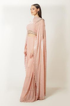 Blush pink georgette blouse with an attached dupatta and sequins, thread and zari embroidery. Comes with box-pleated palazzo.
Components: 2
Pattern: Embroidered
Type Of Work: Sequins, Thread, Zari
Neckline: High Neck
Sleeve Type: Flared Sleeves
Fabric: Georgette
Color: Pink
Other Details: 
Closure: Blouse - Back hooks
Occasion: Sangeet - Aza Fashions Designer Wear Pink Chinon Pre-draped Saree, Designer Pink Pre-draped Chinon Saree, Pink Chinon Pre-draped Saree For Designer Wear, Pink Chinon Pre-draped Saree For Navratri, Pink Georgette Sharara With Sheer Dupatta, Pink Semi-stitched Floor-length Pre-draped Saree, Floor-length Pink Blouse With Resham Embroidery, Pink Floor-length Blouse With Resham Embroidery, Pink Chinon Pre-draped Saree For Party