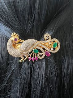 Hair Clip AD Ruby Emerald Stones  Gold Finish / Peacock Designer Hair Clip 2.8 inches Gold Jewelry /Gift Jewelry /South Indian Jewelry This cute hair accessory can be worn for any occasion.  Spring-loaded hair clip. Light-weight. Size: 2.8 inches  Weight: 0.90 oz (26 g) Material: Artificial gold Finish AD Ruby Emerald  Stones. Finish:  Gold finish. PRODUCT CARE: - Avoid contact with water and chemicals such as perfumes or any sprays to prevent product damage.  - Store wrapped in butter paper, cotton cloth, or the provided box. Indian Hair Accessories, Peacock Hair Clip, Butter Paper, Peacock Hair, Silk Thread Bangles Design, Thread Bangles Design, Peacock Jewelry, Gold Jewelry Gift, Handmade Hair Clip