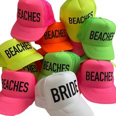 colorful hats with the words beaches on them