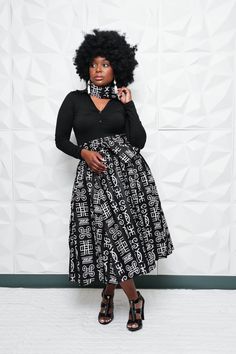 "Black and White Ankara Fabric Below the Knee Maxi Skirt with Matching Head Piece. You are viewing this Fabulous and Sassy African Print High Waisted Bow Skirt with Pockets.  Want this look add the Matching Wrap top! Skirts are one size, fits from a Size small to 2XL. Waist Measurement are up to 40\" waist,  29\" to 30\" long. Also comes with a Matching Head Wrap measurement are 5 1/2\" wide and 50\" long. Thanks for shopping!" Black Skirt And White Top Outfit, Traditional Black Lined Skirt, Traditional Black Flowy Skirt, Ankara Flare Skirt High Waist, Ankara Maxi Skirt And Crop Top, Ankara Tennis Skirt, African Flared Skirt, Ankara Circle Skirt, Maxi Skirt Ankara High Waist