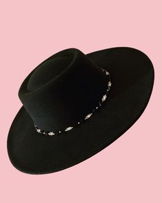 The Tanami hat features a wide brim, and carefully sewn in beads, silver metal Tibetan pieces, and metal studs around the brim.  Its a truly versatile piece which can be worn every day to elevate your outfit, or dressed up for a fancier occasion!  Size medium/large (can be fit to smaller heads by adjusting the band on the inside, and small hat padding may also be added) max 60cm circumference Elegant Flat Brim Hat For Festivals, Adjustable Flat Brim Fedora For Evening, Evening Fedora With Flat Brim, Adjustable Wide Brim Felt Hat For Evening, Party Fedora With Adjustable Flat Crown, Elegant Fedora Hat For Festival, Adjustable Flat Crown Fedora For Party, Elegant Fedora For Festival, Elegant Black Beaded Hat