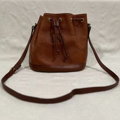 Burberry Leather Bucket Bag, Crossbody. Measurements Are: 9/5" High X 10" Wide X 4.75" Deep. The Strap Is A 19.5" Drop, And Is Adjustable. Classic Burberry Plaid Lining. There Is Some Wear On The Outside As Pictured. The Inside Is Extremely Clean And Has 2 Small Pockets. Burberry Plaid, Leather Bucket Bag, Leather Bucket, Burberry Bag, Bucket Bag, Burberry, Bag Lady, Plaid, Leather