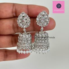 Silver Polki Jhumka/Stone Jhumka/Indian earrings/Indian Jewelry/Pakistani/Punjabi/Indian/Statement earring/Bridal earring/Indian wedding Antique Jhumki With Rhodium Plating Height = 45 mm || Width = 22 mm Classic Jhumki Antique Earring Closure: Pushback This is 100% Handmade jewelry. So Color, shades, and texture displayed may vary slightly from the actual product due to digital image limitations. We request you to consider these minor variations. Please expect the possibility of some slight imp Silver Tilla Bollywood Bridal Earrings, Bollywood Style Silver Bridal Earrings With Tilla, Heavy Silver Bridal Earrings For Wedding, Silver Bridal Earrings For Festive Occasions, Silver Stone Work Earrings For Wedding, Eid Chandbalis With Stone Work In Silver, Silver Bollywood Bridal Earrings With Latkans, Silver Tilla Jhumkas For Party, Silver Bridal Earrings With Latkans For Eid