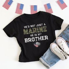 This patriotic He's / She's Not Just A Marine, He / She Is My Brother (Sister, Son, Daughter, Dad, Mom, etc.) kid's t-shirt with personalized Marine name on US flag dog tags is designed for a proud military family member - perfect for boot camp graduation, going away or welcome home party! **Designed by a proud Air Force Mom!** Makes a great gift for special occasions like birthday, holidays, Mother's Day or Father's Day. Easily customize for male or female Marine, dog tag name, and family relationship - and you can choose adult, kids, and baby sizes! Other armed forces branches are available in my Zazzle storefront (click on "FigLilyCo--Military" shop link in the right-hand corner of this page, and again on my shop name there, and head to the "T-Shirts & Clothing" category to see more! Cu Marine Sister Shirts, Usmc Graduation, Marine Dog, Marine Sister, Welcome Home Party, Military Dog Tag, Boot Camp Graduation, Military Shop, Welcome Home Parties