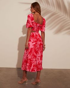 Straight neckline Can be worn on or off the shoulder Side cutouts Smocked Tropical print Midi length Lined 100% Polyester Runs Small Vacation Midi Dress With Smocked Back And Straight Neckline, Vacation Dress With Smocked Back And Straight Neckline, Red Midi Dress With Straight Neckline For Summer, Vacation Dresses With Ruched Straight Neckline, Vacation Dresses With Ruched Detail And Straight Neckline, Casual Pink Dress With Gathered Neckline, Red Square Neck Beach Dress, Red Square Neck Dress For Beach, Red Smocked Bodice Dress With Square Neck