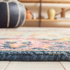 an area rug with various colors and patterns