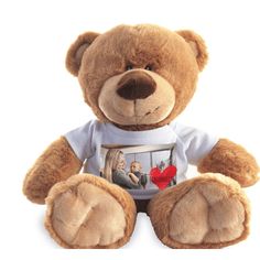 a brown teddy bear wearing a t - shirt with an image of two people on it