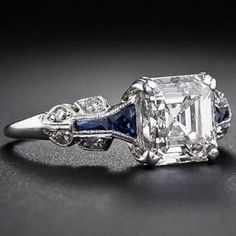 an old - fashioned diamond and sapphire engagement ring