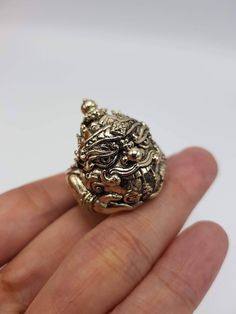 Beautifully made Thai amulet Phra Rahu Ring , by Portan Koly Anomo.  Phra Rahu will bring up your downfall faith, ward away dangers and prevent curses and black magic, keep protection. Those who have difficult or many obstacles in life should worship Phra Rahu, as he will make your life, your career smoother and bring success to you. Free size, adjustable ring. Spiritual Jewelry Locket For Blessing, Spiritual Locket Jewelry For Blessing, Handmade Symbolic Jewelry For Blessing, Good Luck Brass Amulet Jewelry, Engraved Amulet Jewelry For Good Luck, Collectible Carved Bronze Jewelry, Bronze Carved Collectible Jewelry, Carved Amulet Jewelry For Collectors, Handmade Jewelry Ring For Meditation