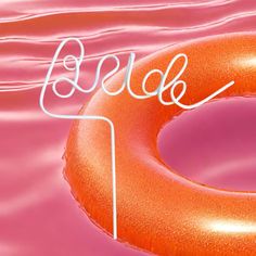 an orange ring floating on top of water with the word bubble written in white above it