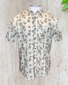 Opihi ohana designed in Wailuku, Maui by Jaclynn Eitel-Sabado. True to size with a soft 55% linen and 45% cotton blend. Beige Cotton Shirt For Vacation, Summer Cotton Shirt With Batik Print, Short Sleeve Linen Shirt With Floral Print, Printed Short Sleeve Linen Shirt, Beige Cotton Printed Shirt, Beige Printed Cotton Shirt, Printed Linen Short Sleeve Shirt, Casual Linen Patterned Shirt, Casual Brown Tops With Batik Print