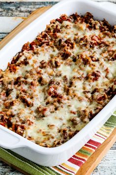 a casserole dish filled with meat and cheese