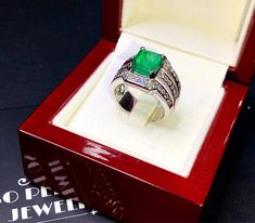 BRAND-NEW!! ONE OF A KIND, HANDCRAFTED RING. EXQUISITE AND FINE CRAFTSMANSHIP! HANDMADE TO LAST FOR AN ETERNITY!! HEIRLOOM PIECE!! PRECIOUS JEWELRY TO BE PASSED ON! PERFECT DRESS RING FOR A LADY OR A GENTLEMAN! 4.25 total carats weight, Certified, Natural emerald ring. This ring offers an important statement of who you are with a jumbo 3.51 carats, VIVID GREEN, transparent, ZAMBIAN EMERALD. Accentuating the EMERALD are the 40 SUBSTANTIAL E/VS, sparkling natural diamonds SUGGESTED RETAIL VALUE: $ Luxury Rectangular Emerald Ring In White Gold, Luxury Rectangular Emerald Ring, Luxury Rectangular Emerald Ring As A Gift, Luxury Rectangular Emerald Ring For Gift, Luxury Gift Emerald Ring Rectangular Shape, Luxury Hallmarked Emerald Cut Signet Ring, Luxury Vvs Clarity Emerald Ring As A Gift, Luxury Vvs Clarity Emerald Ring Gift, Luxury Diamond Cut Emerald Ring As Gift