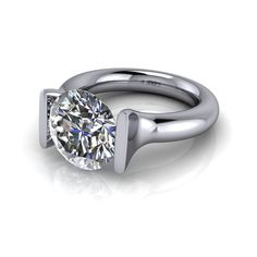 Modern Rings With Brilliant Cushion Cut, Modern Rings With Brilliant And Cushion Cut, Modern Platinum Diamond Ring With Cushion Cut, Modern Cushion Cut Diamond Ring With Center Stone, Modern Cushion Cut Platinum Diamond Ring, Modern Round Brilliant Cut Rings, Modern Brilliant Cut Round Rings, Modern Moissanite Rings For Formal Occasions, Modern Cushion Cut Diamond Ring