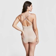 This versatile bodysuit is the ultimate solution for low-back dresses! The flawless-finish fabric is lightweight, cling-free, and offers 360 degrees of comfortable, single-layer shaping for a sleek, all-over feel. And, best of all? The innovative design features lightly padded, fit-flexible wireless cups and adjustable, convertible straps for a variety of styling options Stretch Backless Bodysuit With Built-in Bra, Backless Nylon Leotard With Built-in Bra, Sculpting Backless Swimwear With Built-in Bra, Second-skin Shapewear Leotard With Built-in Bra, Shapewear Leotard With Built-in Bra, Shaping Backless Bodysuit With Built-in Bra, Fitted Backless Leotard With Built-in Bra, Elegant Backless Shapewear With Built-in Bra, Micro-elastic Leotard With Lined Body