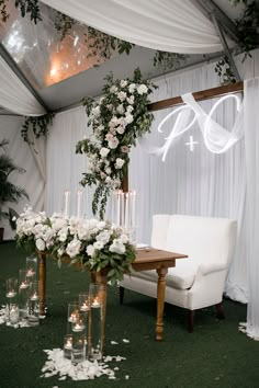 a white chair and table with flowers on it