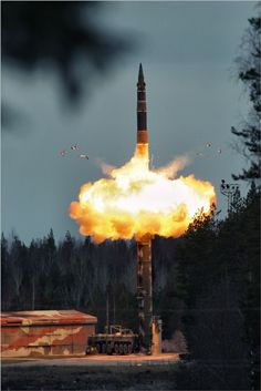 a rocket is being launched into the sky