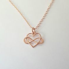 Rose gold infinity Heart Necklace + Rose gold filled flat oval chain (1.6mm) + Rose gold plated on sterling silver infinity heart charm (16mm) + Rose gold filled spring clasp * Every item comes in a pretty gift box * Please contact me for custom sizes or designs Rose Gold Cable Chain Jewelry Gift, Rose Gold Jewelry With Cable Chain For Gift, Rose Gold Heart Pendant With Cable Chain, Hypoallergenic Rose Gold Sterling Silver Charm Necklace, Rose Gold Open Heart Charm Necklace With Delicate Chain, Rose Gold Sterling Silver Charm Necklaces For Wedding, Rose Gold Sterling Silver Charm Necklace For Anniversary, Rose Gold Sterling Silver Charm Necklace For Wedding, Rose Gold Sterling Silver Heart Charm Necklace